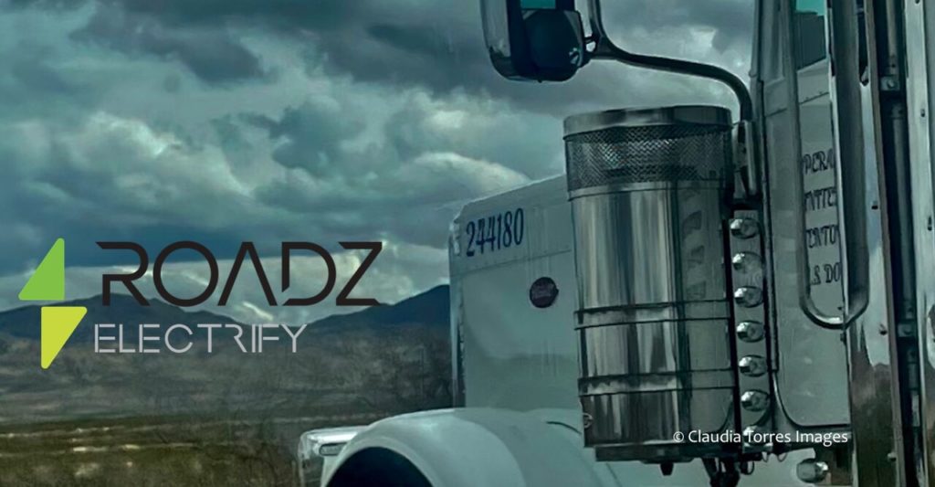 roadz electrify logo overlay with semi truck in mountains