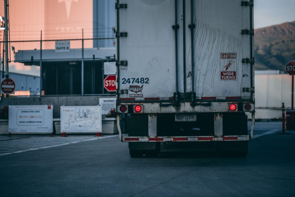 truck pulling into warehouse lot